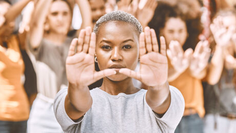 Protest, stop hands and black woman with people fighting for pe